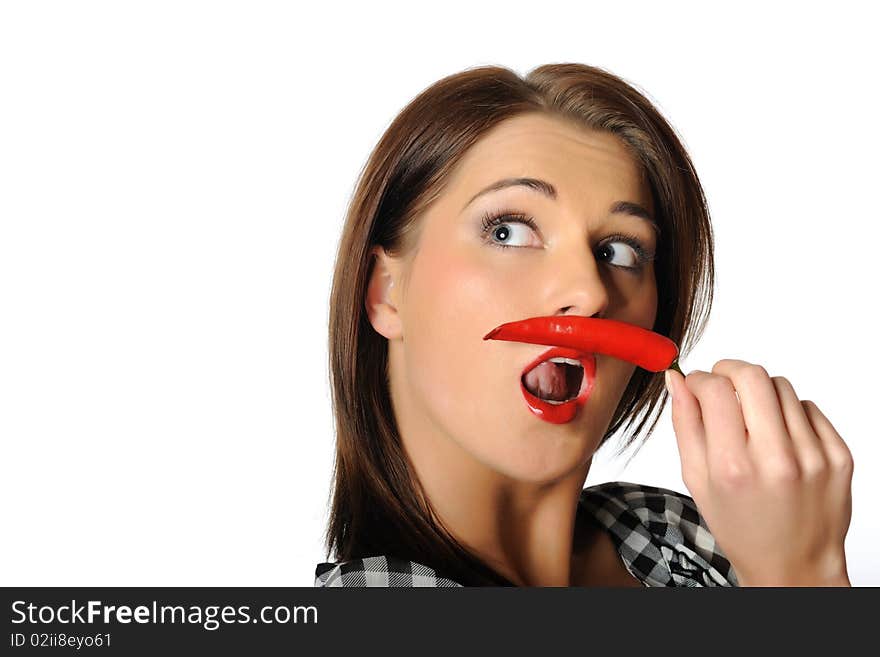 Beautiful sexy woman with red hot chilli pepper. isolated on white background