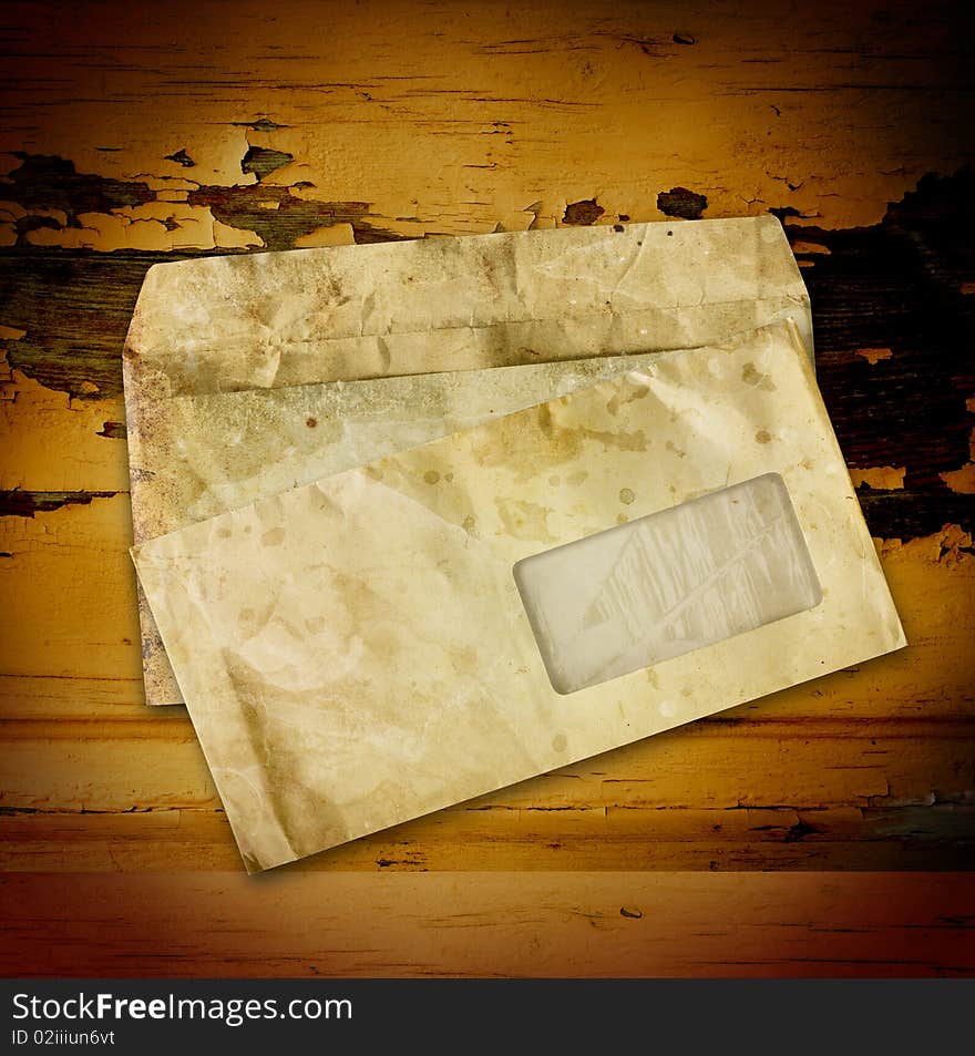 Old envelopes with some spots on a wooden background