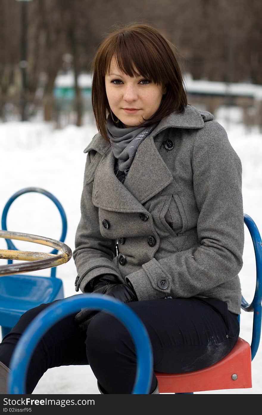 Closeup portrait of a girl walking in winter park