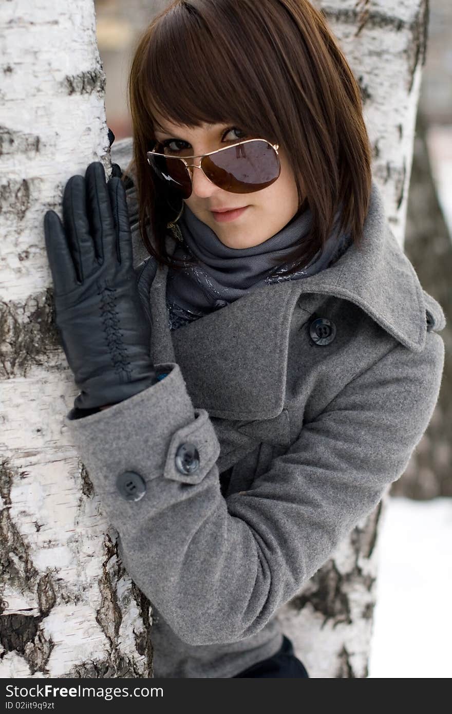 Closeup portrait of a girl walking in winter park