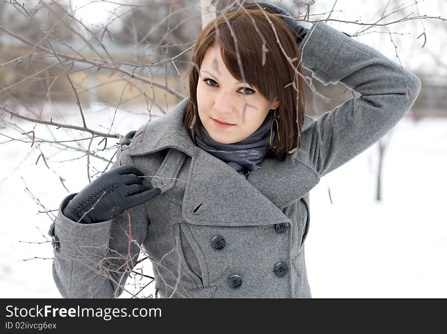 Closeup portrait of a girl walking in winter park