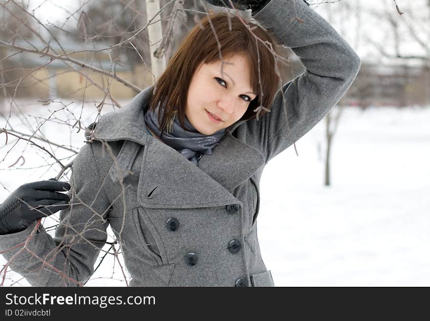 Closeup portrait of a girl walking in winter park