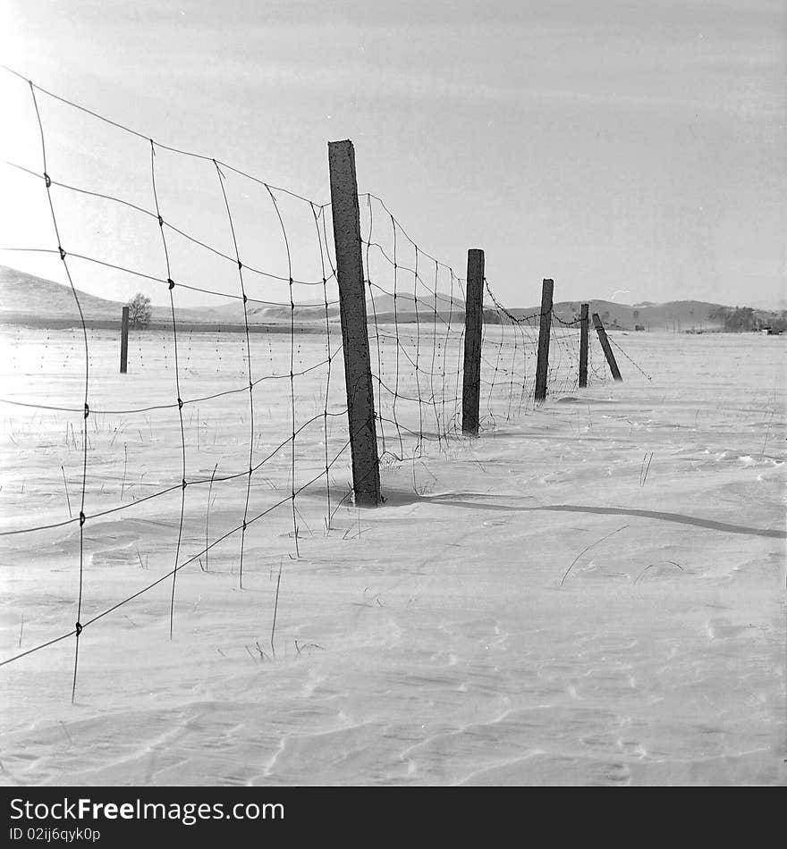 A broken fence in the snow,shooting in bashang of Hebei CHINA.