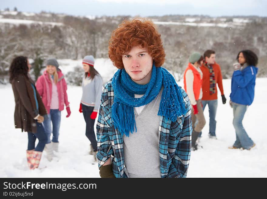 Young Friends Having Fun In Snowy Landscape