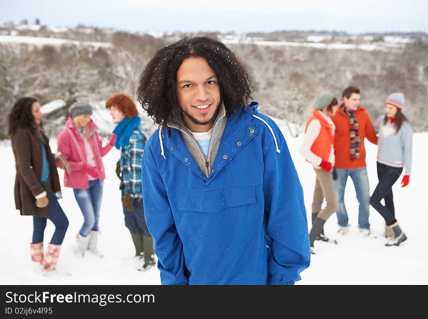 Group Of Young Friends Having Fun In Snowy Landscape