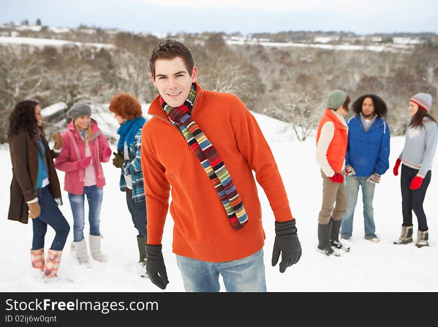 Young Friends Having Fun In Snowy Landscape