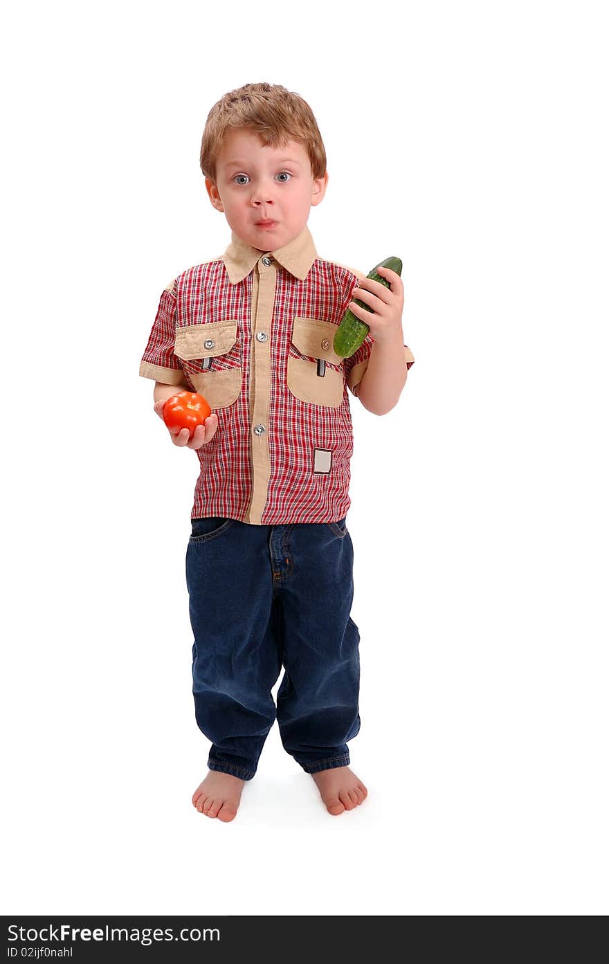 The little boy with vegetables on white background