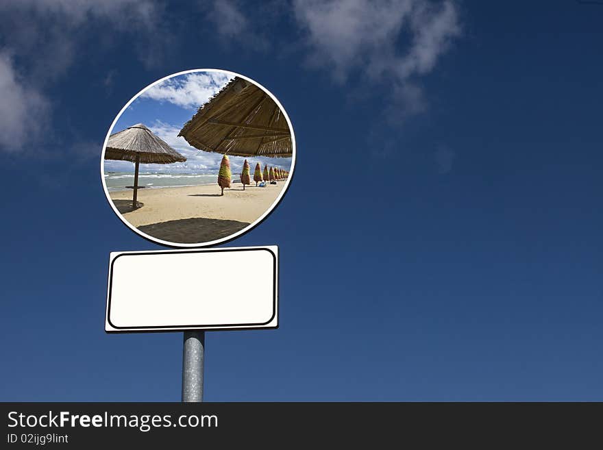 Signpost suggests going on holiday to the sea if it snows. Signpost suggests going on holiday to the sea if it snows