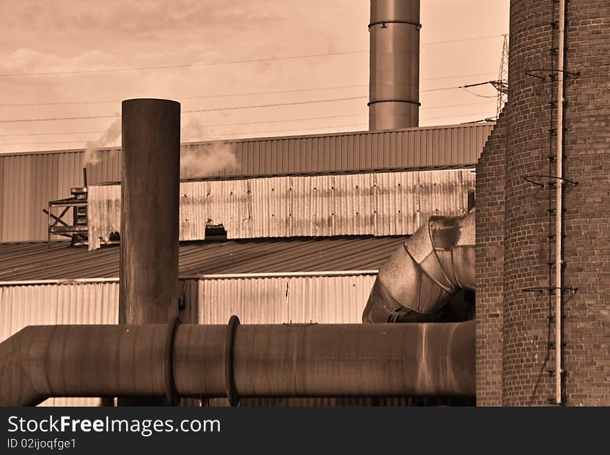 Part of the Heat and Gas Pipes of a modern Furnace to Produce Steel Old Furnace seen from below sepia. Part of the Heat and Gas Pipes of a modern Furnace to Produce Steel Old Furnace seen from below sepia