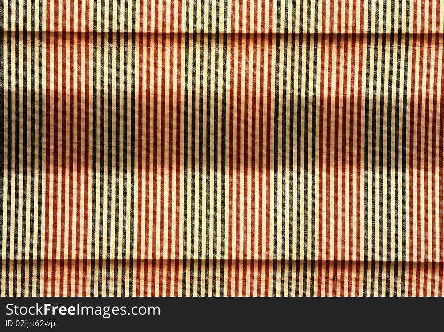 Closeup of colorful striped pattern on a picnic tablecloth. Closeup of colorful striped pattern on a picnic tablecloth.