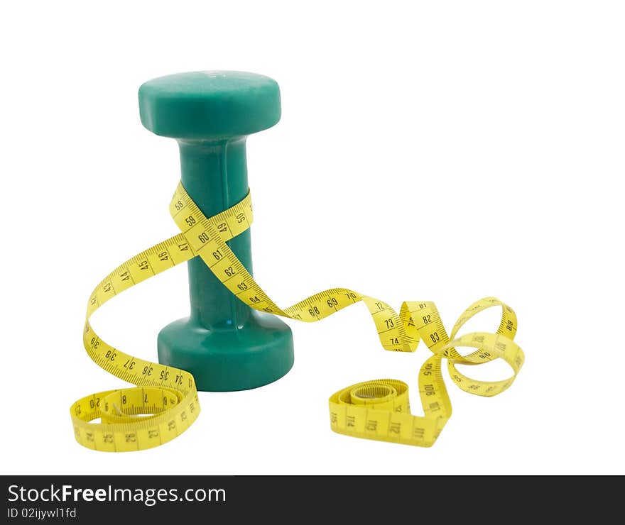 Green dumbbell and yellow tape measure isolated on a white background. Green dumbbell and yellow tape measure isolated on a white background