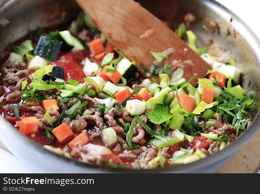 Preparing sauce alla Bolognese