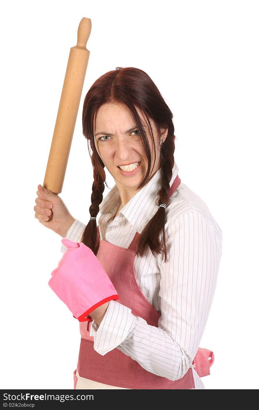 Mad housewife with a rolling pin on white background