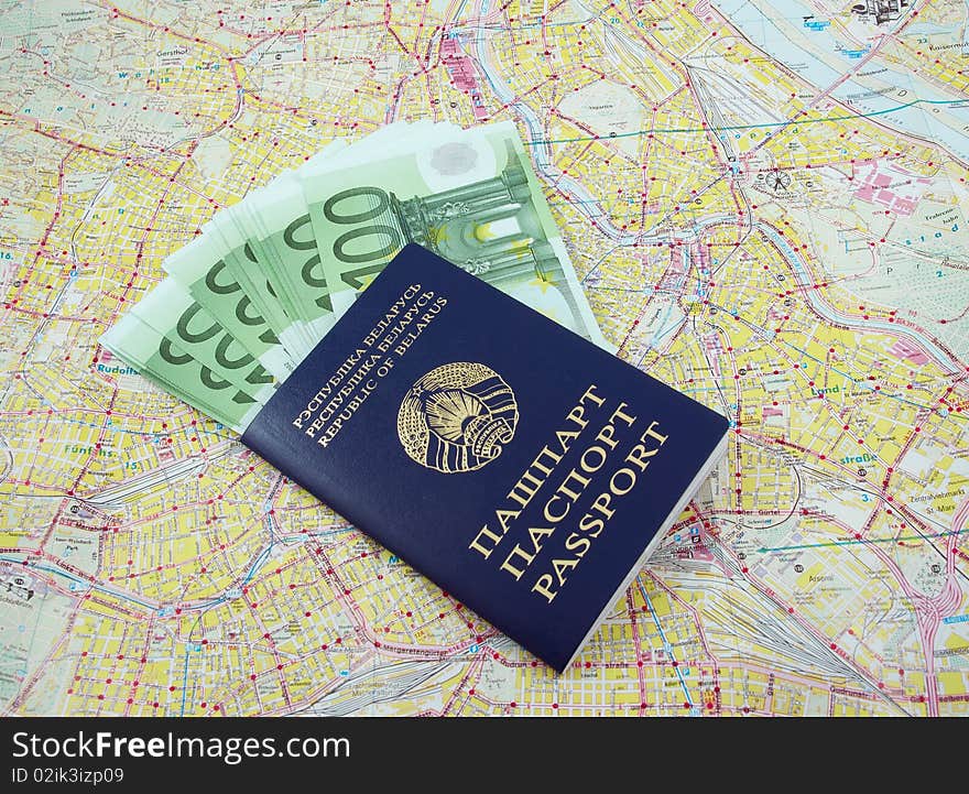 Belarusian passport and one hundred euro banknotes over a map. Belarusian passport and one hundred euro banknotes over a map