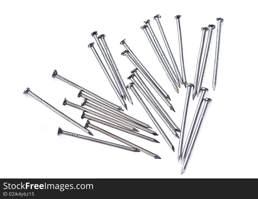 Photo of steel nails, scattered on the white background