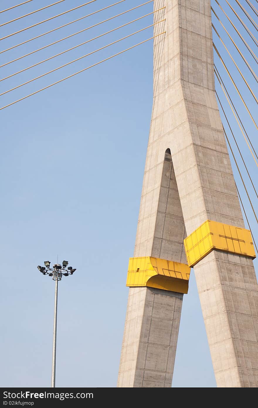 Lamp and bridge on the blue sky