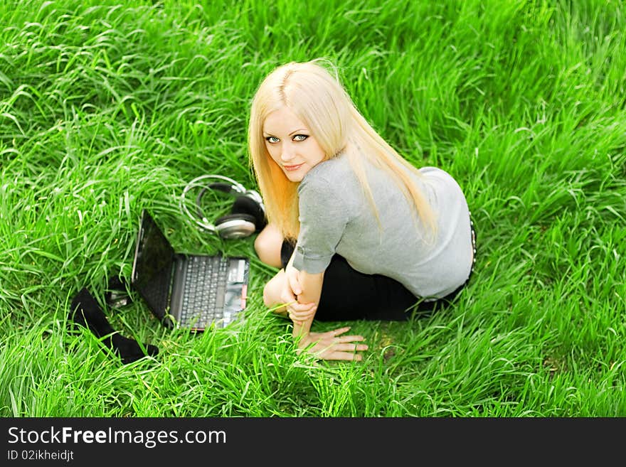 Beautiful business woman with the laptop