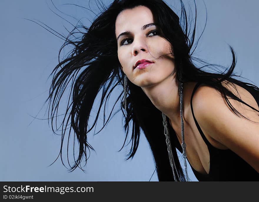 Portrait of young hispanic brunette beauty with long hair