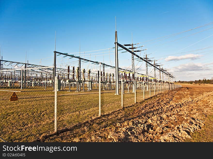 Electricity relay station with high-voltage insulator and power lines. Electricity relay station with high-voltage insulator and power lines