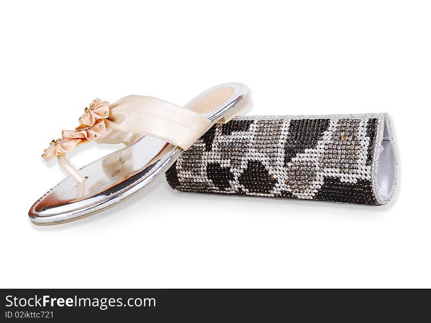 This is a beautiful ladies fancy shoes and clutch purse isolated on a white background. This is a beautiful ladies fancy shoes and clutch purse isolated on a white background.