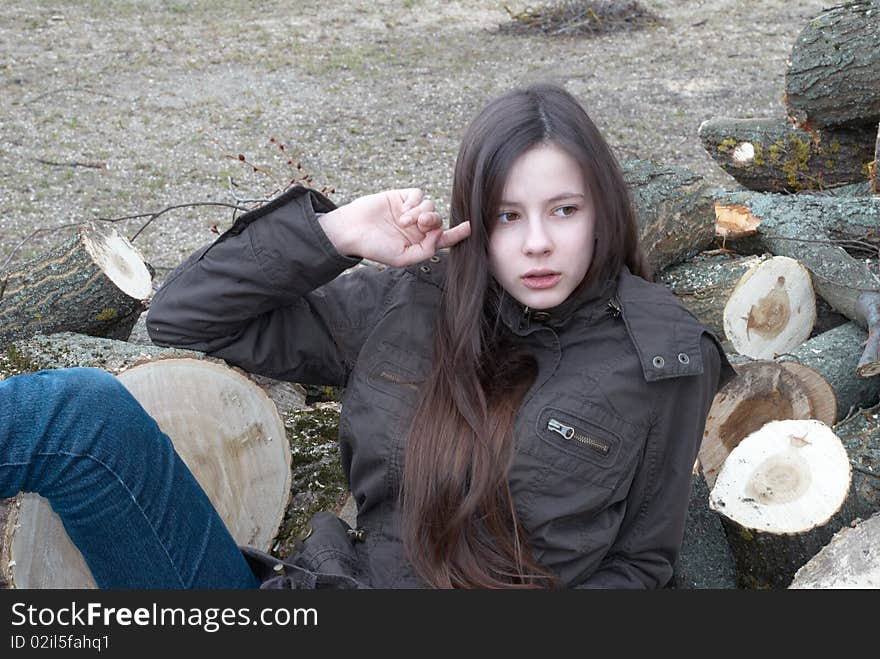 Beautiful Girl Lying On Logs