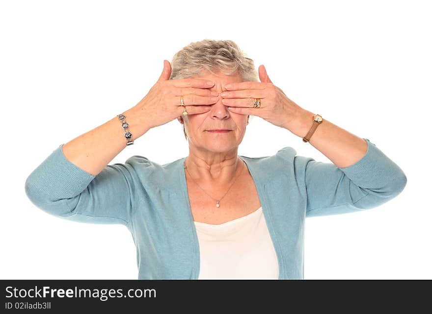 Senior older woman isolated on white covering eyes. Senior older woman isolated on white covering eyes