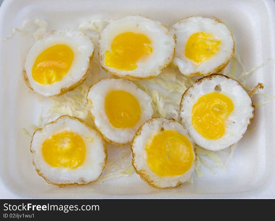 Quail eggs on a white plate