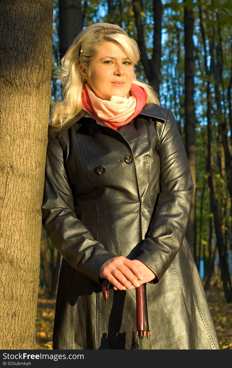 Young woman in a leather coat