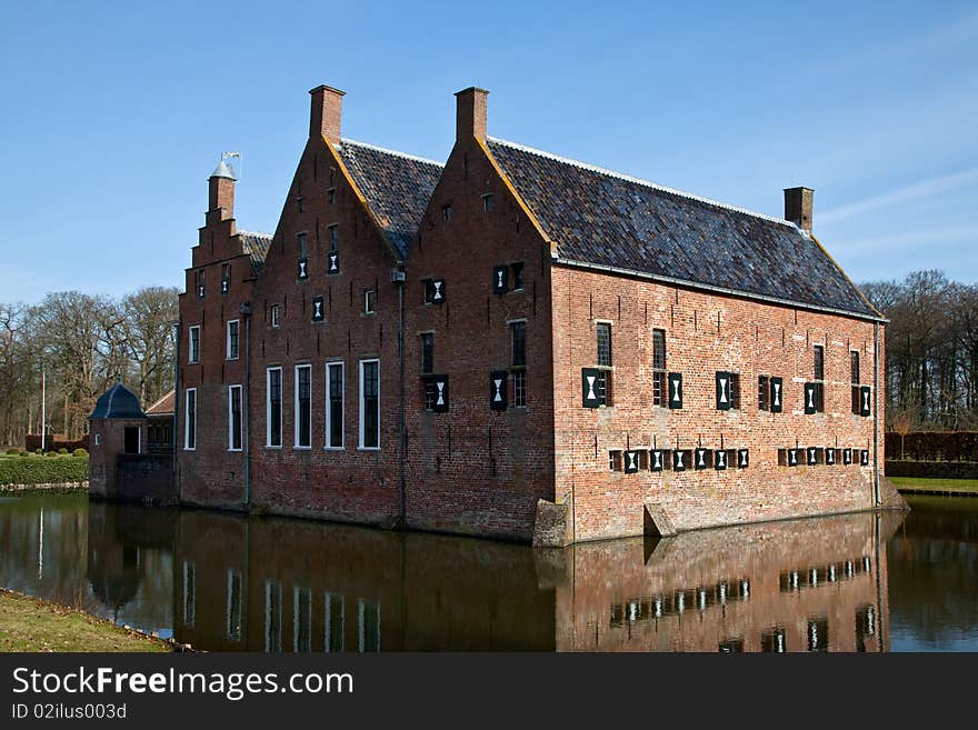 Old medieval mansion with water defence