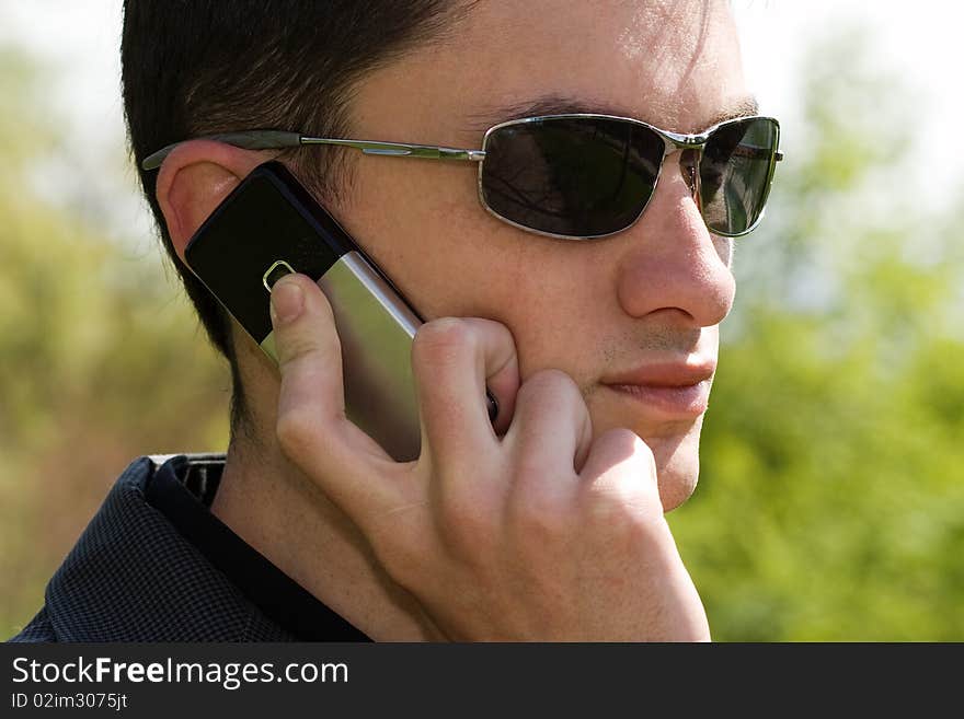 Portrait of young businessman with mobile phone. Portrait of young businessman with mobile phone