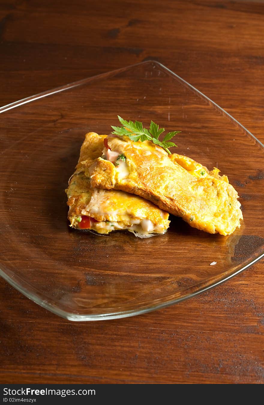 Photo of omelette with cheese, ham and tomatoes