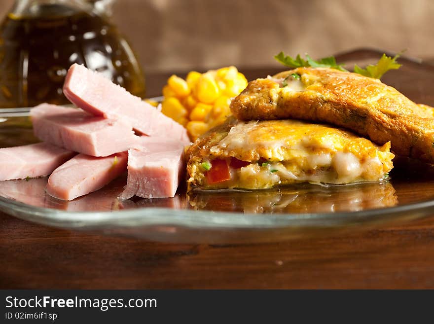 Photo of omelette with cheese, ham and tomatoes