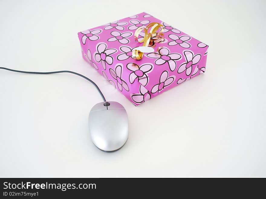 A present with a computer mouse. A present with a computer mouse