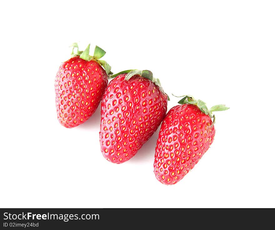 Three ripe strawberries isolated on white background