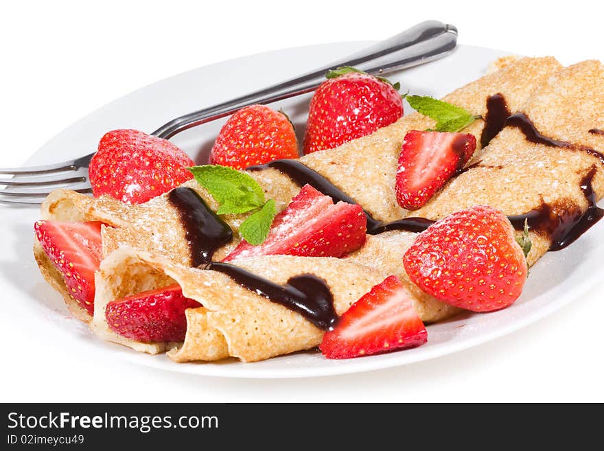 Pancakes with strawberry on white background