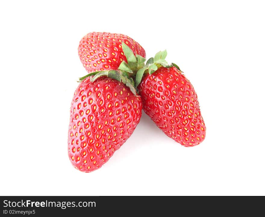 Three ripe strawberries isolated on white background