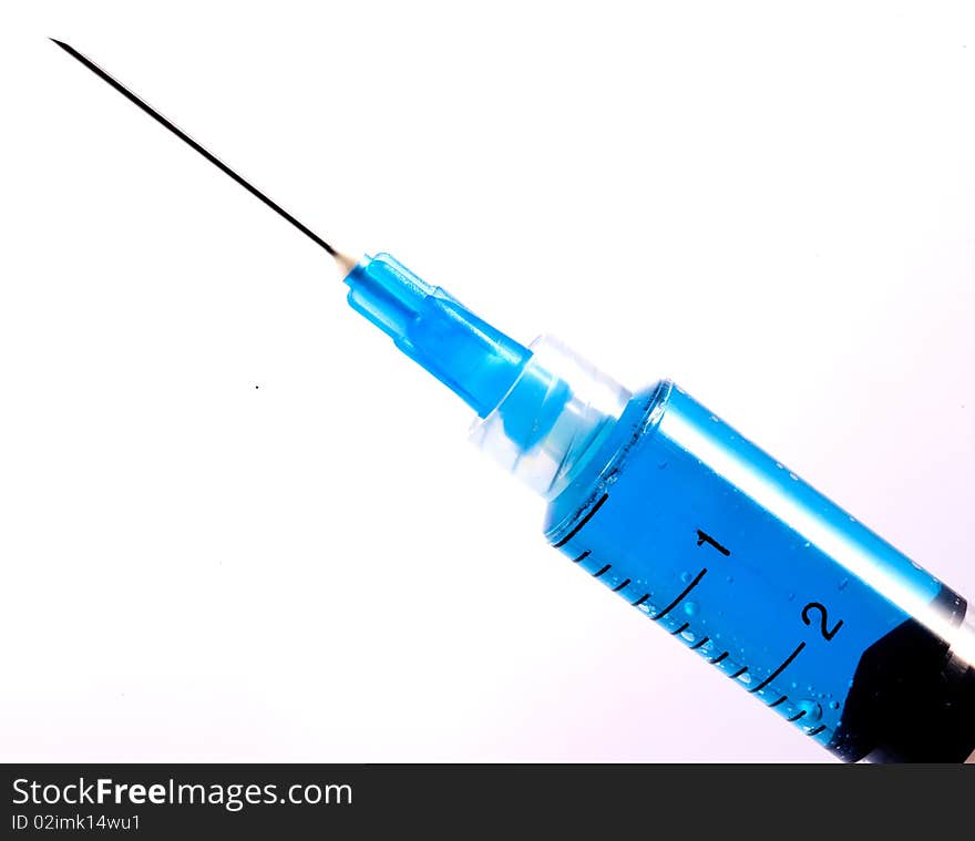 Blue Syringe With Hypodermic Needle on WhiteBackground