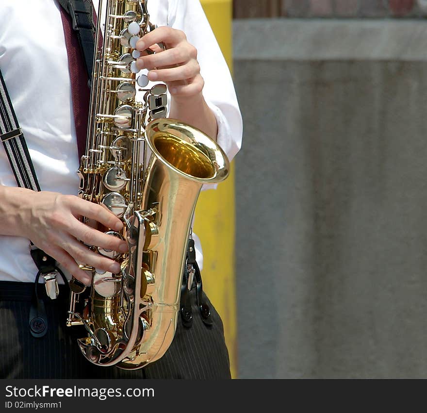 Playing saxophone, getting in tune.