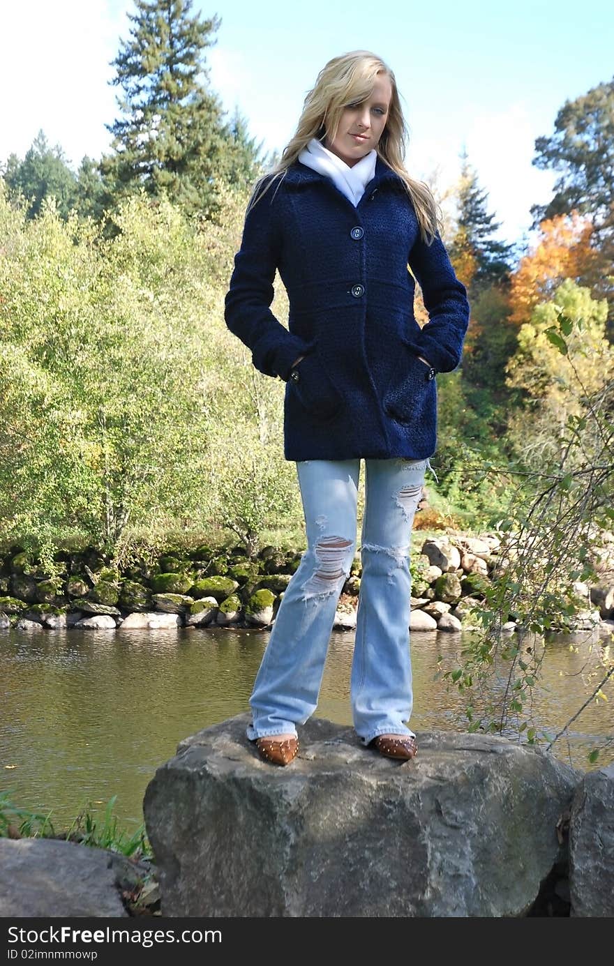 Woman Standing On A Rock