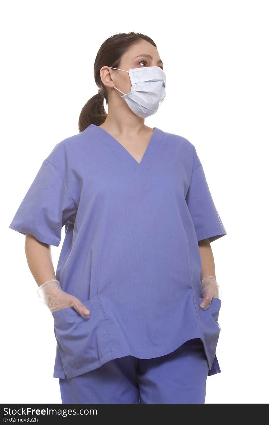 Female doctor in surgical mask and scrubs