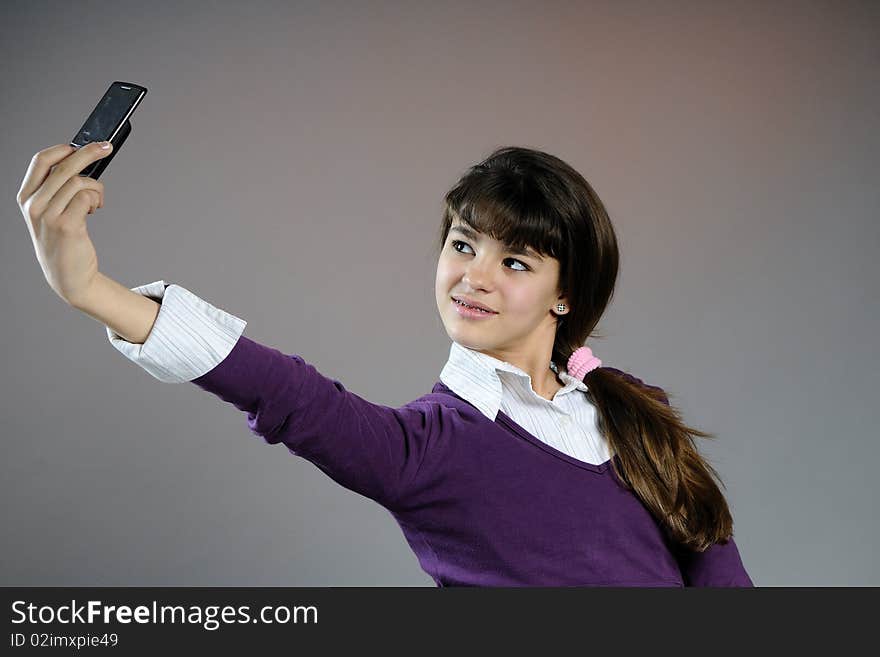 Teenager making photos with mobile phone