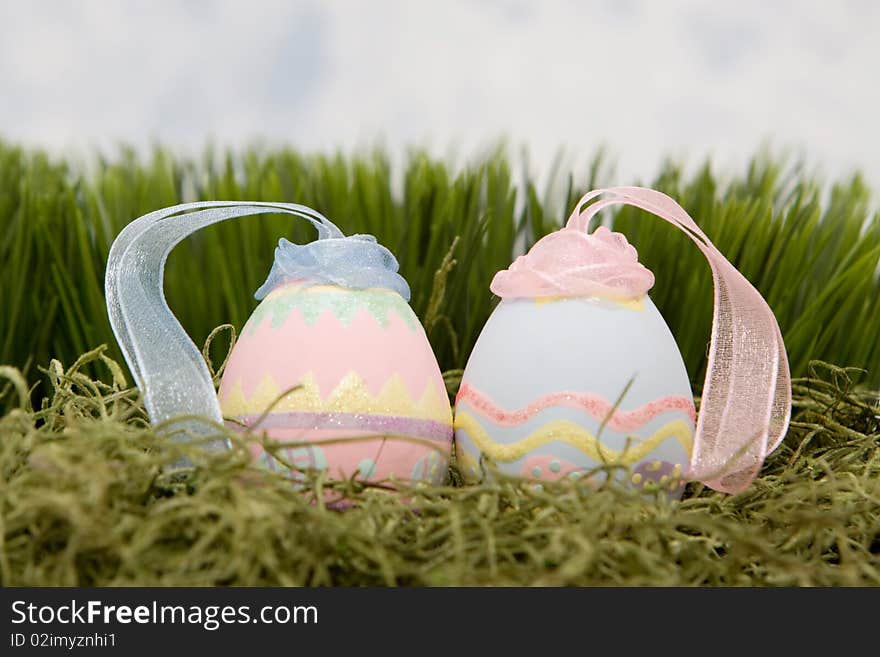 Decorative easter eggs on green grass