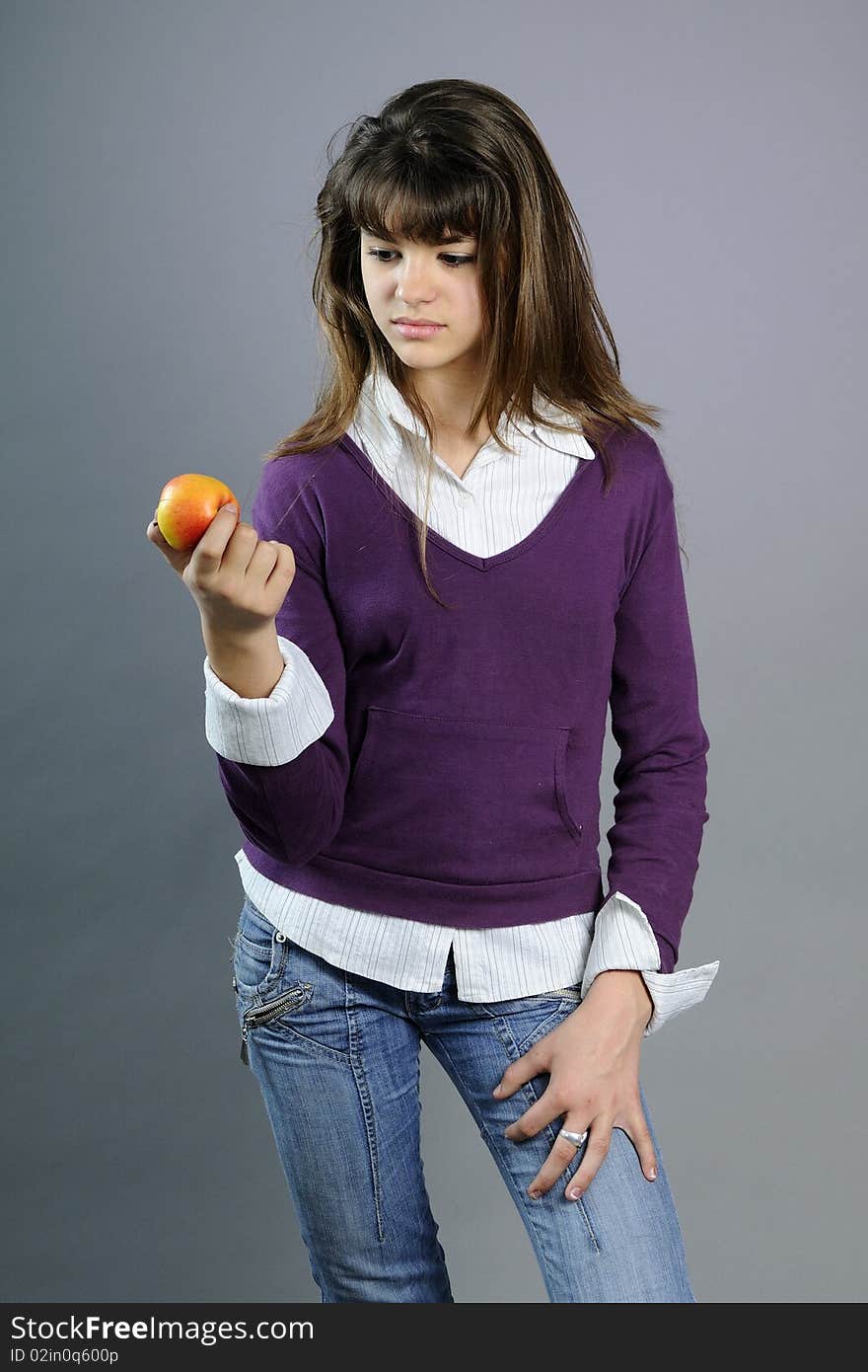 Teenager evaluating healthy fruit