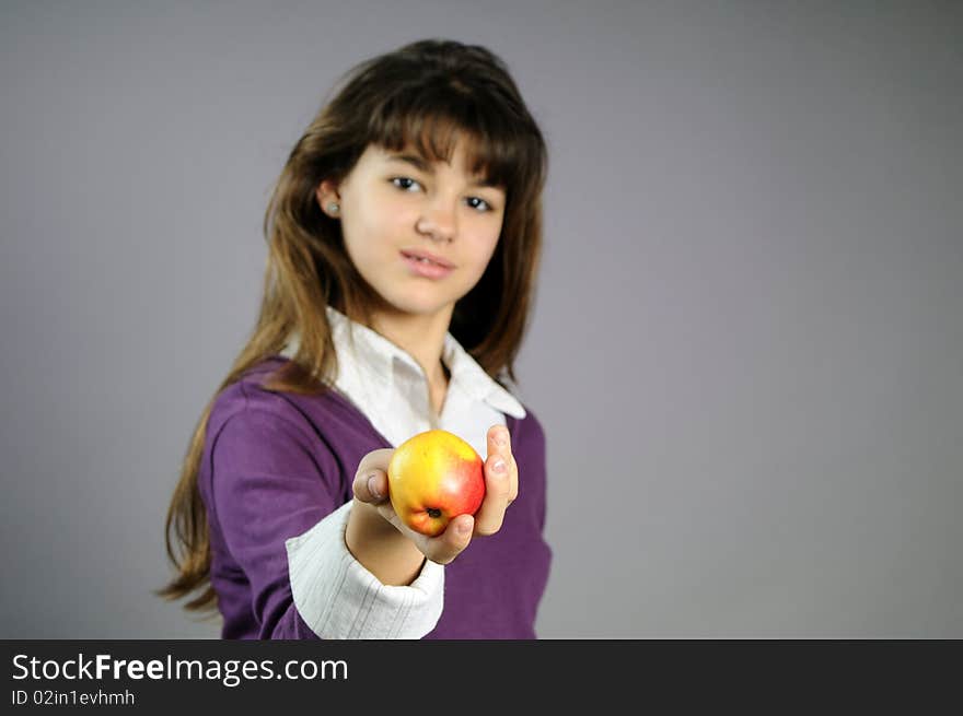 One school girl offering healthy fruit