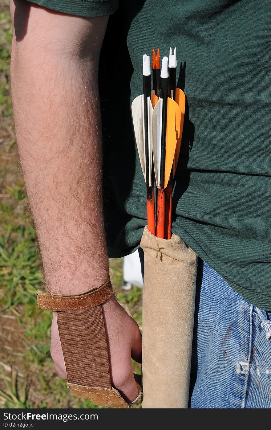 A bunch of arrows in a leather brown pouch holder. A bunch of arrows in a leather brown pouch holder.