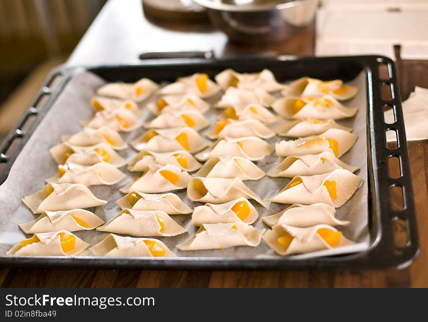 Many small croissants before baking. Many small croissants before baking