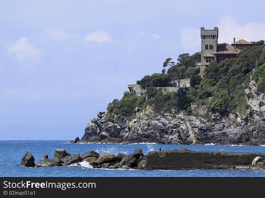 A corner of italian riviera with a beautiful castle over the sea. A corner of italian riviera with a beautiful castle over the sea.