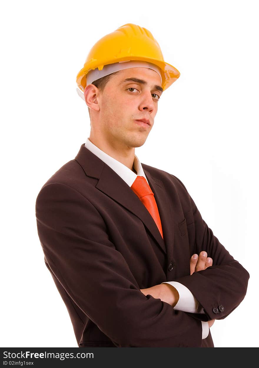 Young engineer portrait with a yellow helmet, isolated on white