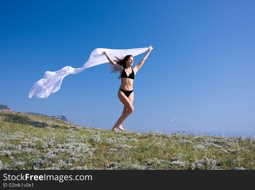 Woman with white material and nature