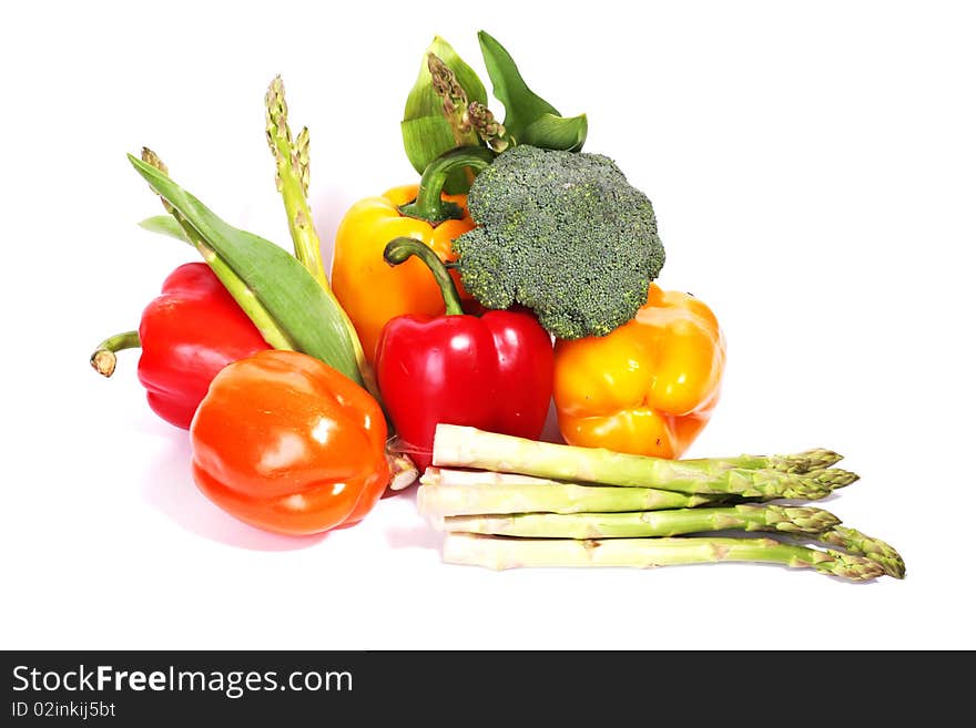 Heap of fresh ripe vegetables isolated at white background